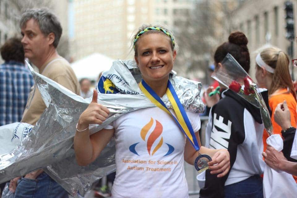 Photo of Laura Shay while running for ASAT in the Boston Marathon